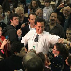 Republican presidential candidate, former U.S. Sen. Rick Santorum greets diners and volunteers during a campaign stop in Walled Lake, Michigan. 